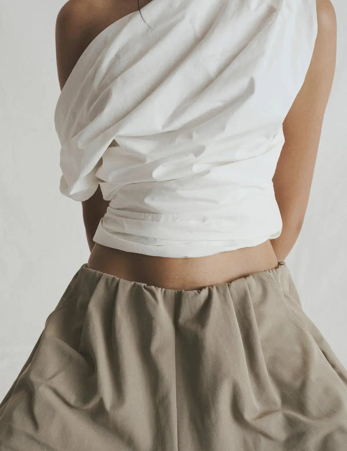 White asymmetric sleeveless top