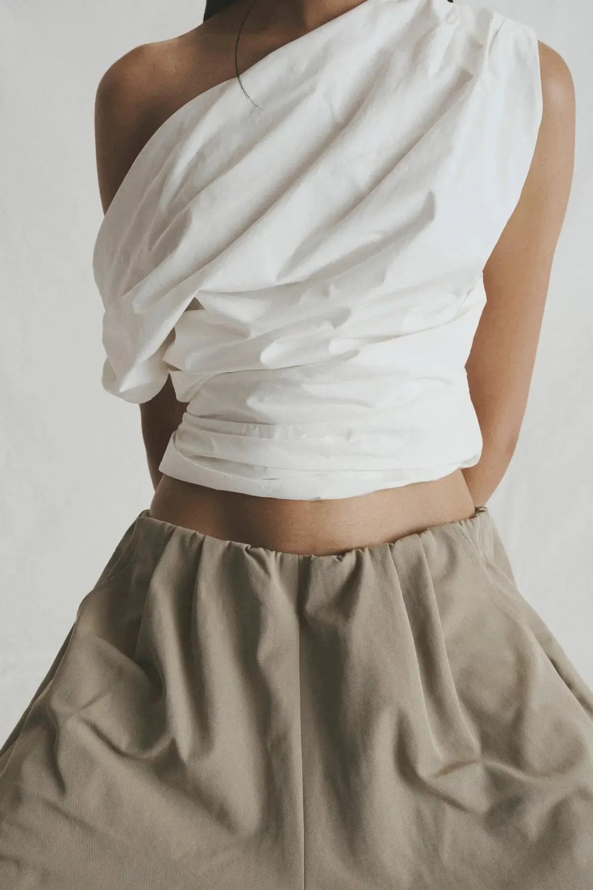 White asymmetric sleeveless top