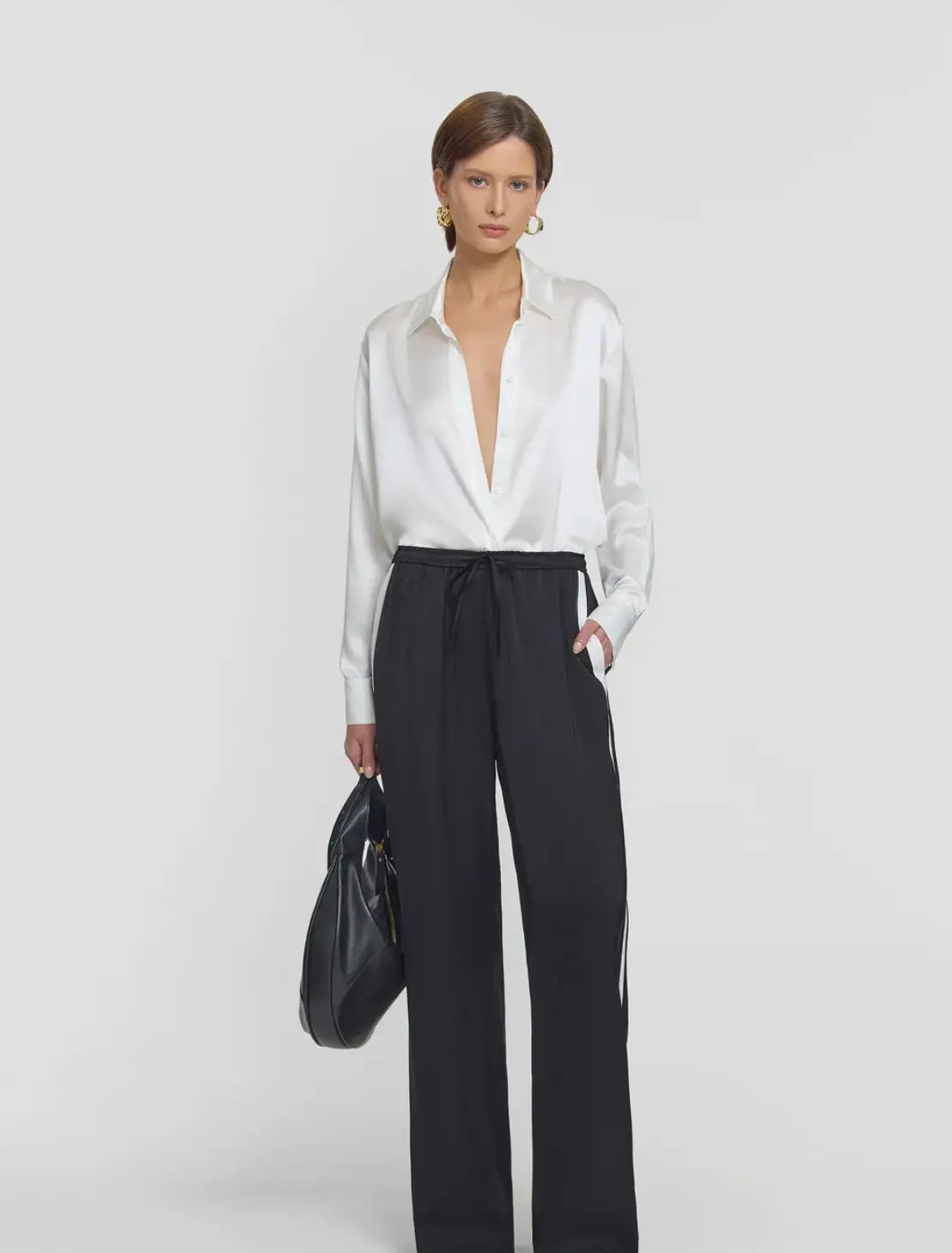 Black pant with white stripe by elka collective at clothlifestyle boutique