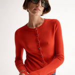 Red cardigan with metal buttons Elka Collective at clothlifestyle boutique 