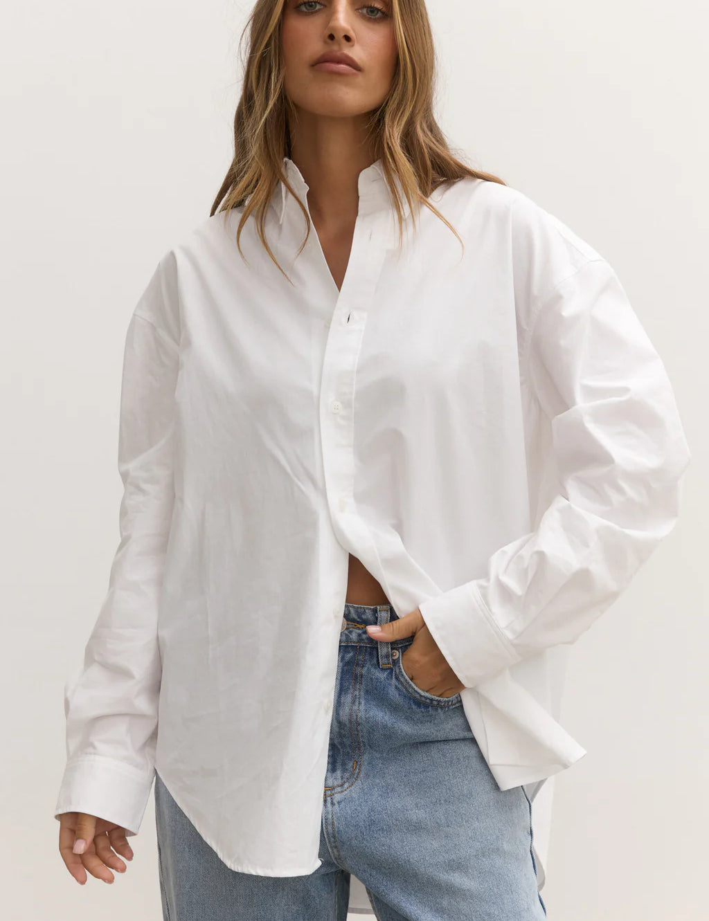 White long sleeve shirt with blue bayse jeans at clothlifestyle boutique 