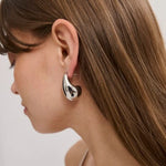 tear drop earring in gun
