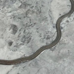 snake chain necklace in gun