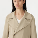 stretch twill coat in light tan close up