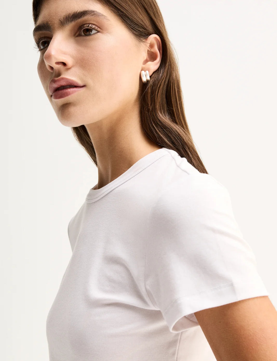 Elka Collective Bonnie Tee in white, featuring a fitted silhouette, classic bound neckline and soft lyocell-blend fabric.