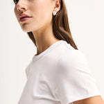 Elka Collective Bonnie Tee in white, featuring a fitted silhouette, classic bound neckline and soft lyocell-blend fabric.