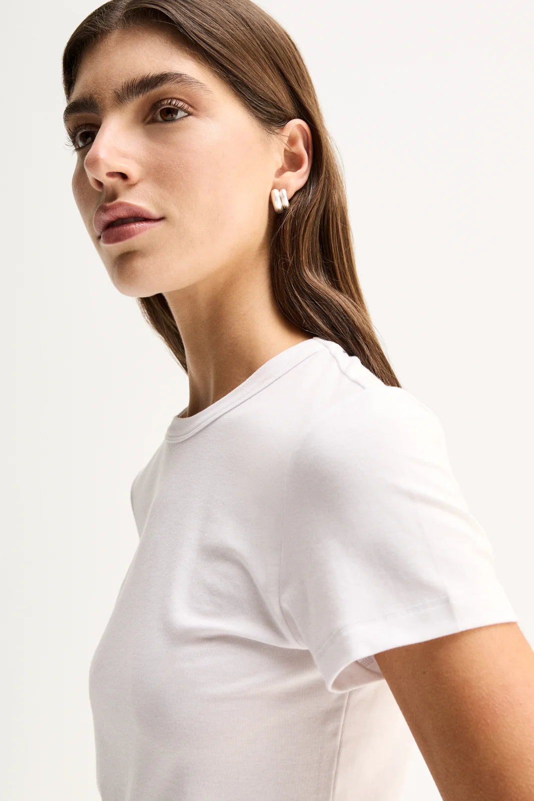 Elka Collective Bonnie Tee in white, featuring a fitted silhouette, classic bound neckline and soft lyocell-blend fabric.